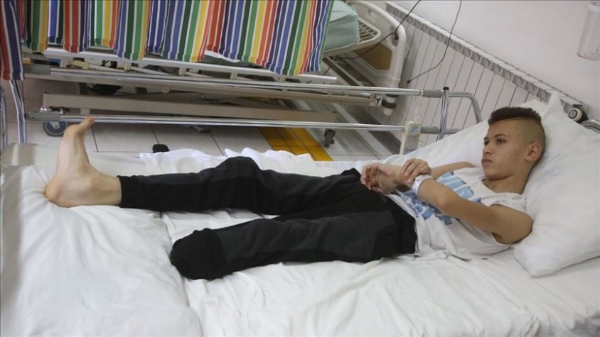 A person lying on a bed

Description automatically generated